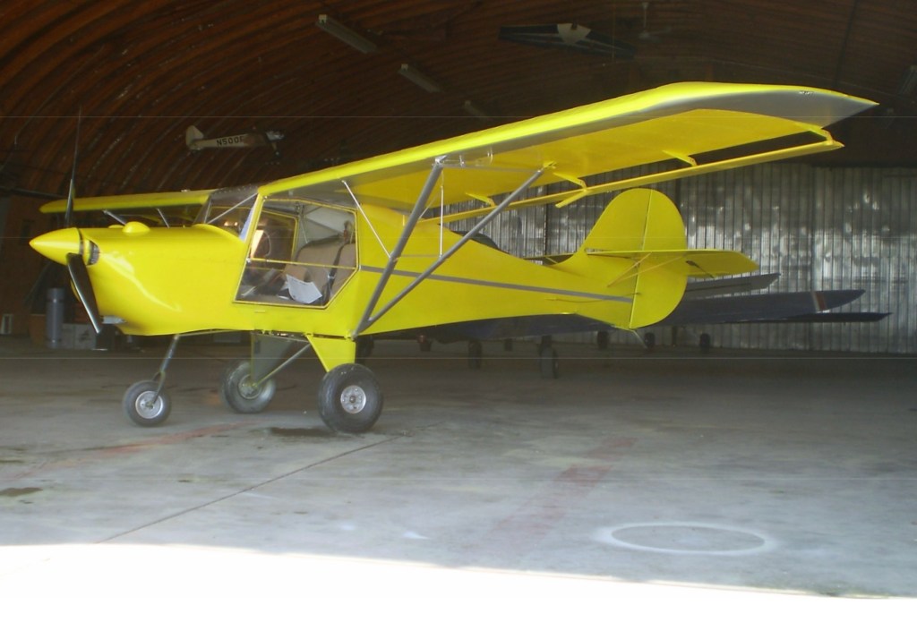 Photo: Yellow airplane in hanger ©CRFCYYC