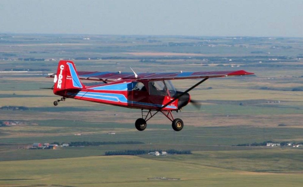 Photo: Blue & red airplane flying ©CRFCYYC
