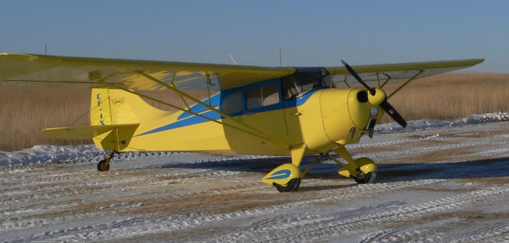 Photo: Yellow & blue airplane ©CRFCYYC