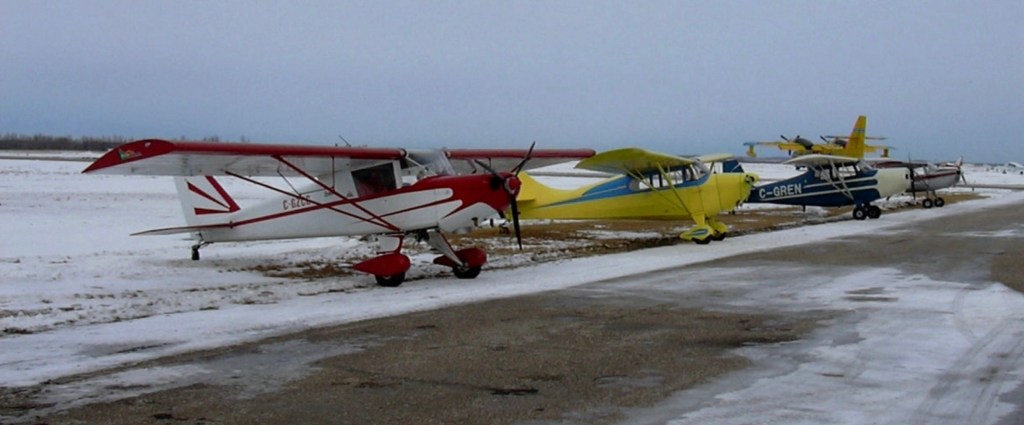 Photo: Airplanes parked along runway ©CRFCYYC