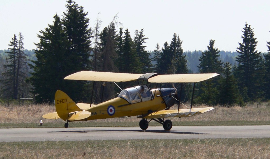 Photo: Yellow airplane on runway