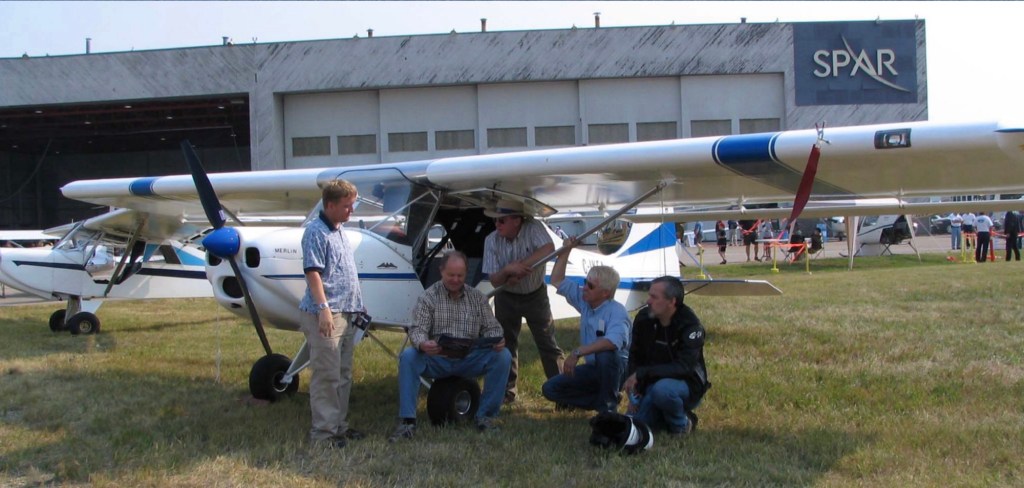 Photo: Pilots chatting by airplane ©CRFCYYC